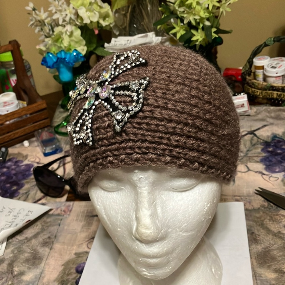 Headwear from R&M Brown with large cross with rhinestones